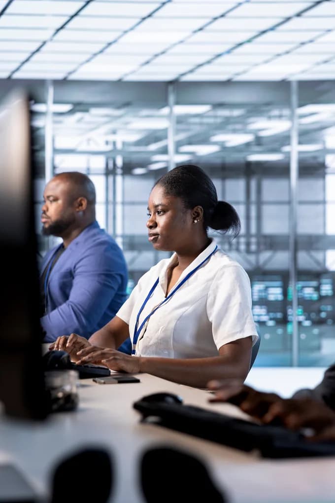 Operations staff monitoring service activity inside an airport facility