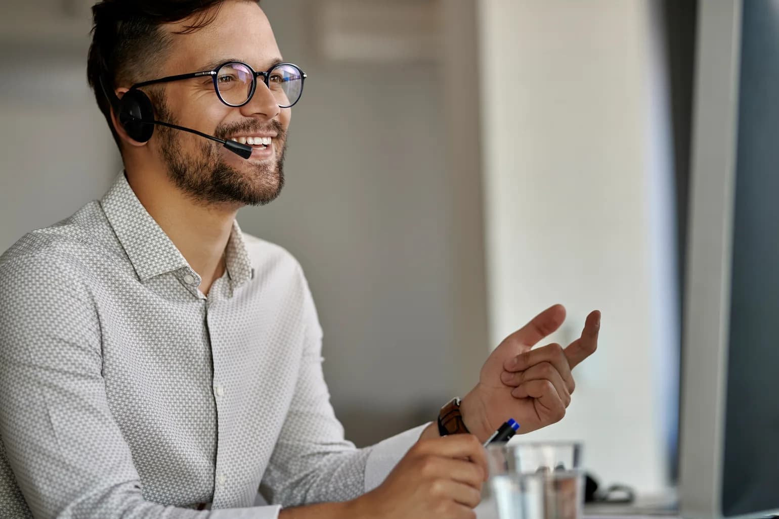 A coordinator taking a booking call at a support desk