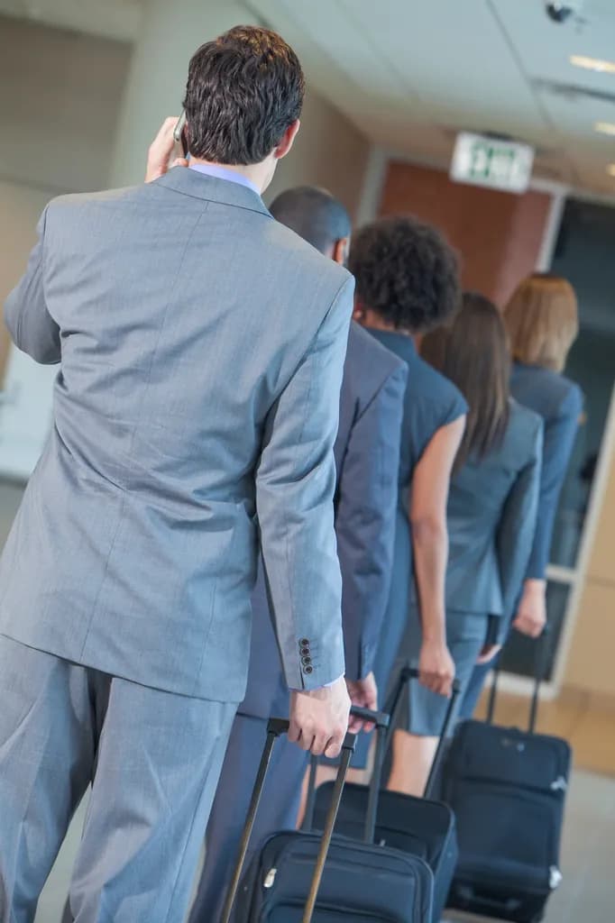A greeter briefing travelers before their flights