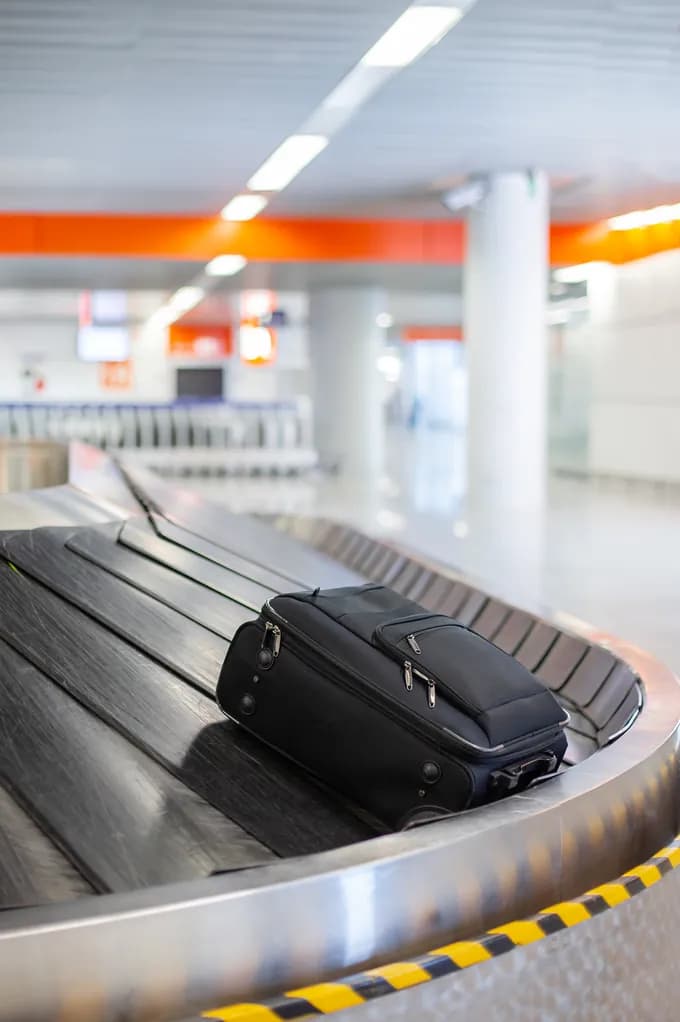 A suitcase travelling along a baggage reclaim belt